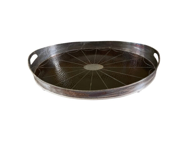 Shop lot # 38 the Silver Plate Tray with Croc Leather in the Town & Sea Southampton Estate Sale, the auction closes 9/27 at 8pm. This product is 24"w x 16"d x 3"h and its condition details are: A piece of leather is peeling up from the tray bottom, see photos. Also is tarnished. Place your bids on https://townandsea.com/sales/southampton-estate-sale/ today!