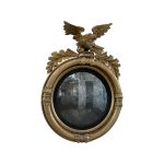 Shop lot # 5 the Gilt Carved Wood Eagle Convex Mirror in the Town & Sea Southampton Estate Sale, the auction closes 9/27 at 8pm. This product is 22"w x 9"d x 29"h and its condition details are: Extremely fragile, paper backing is ripping and a few pieces have been reattached, see photos. Place your bids on https://townandsea.com/sales/southampton-estate-sale/ today!