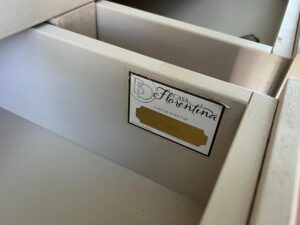 A custom-made drawer with a label displaying "Casa Florentina" and "Custom Made For." The drawer appears to be open, showing its internal structure.