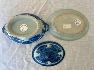 Blue and white ceramic tureen and lid featuring floral patterns; the bottom shows a label reading "Tray for Tureen.