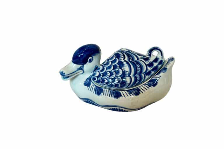 Royal Copenhagen Tranquebar Blue Duck Bonbonniere, a ceramic container featuring intricate patterns and a detailed wing design, presented on a white background.