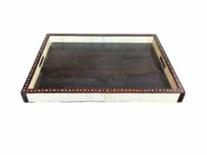 A square wooden tray with a dark brown surface and light-colored, ribbed sides.