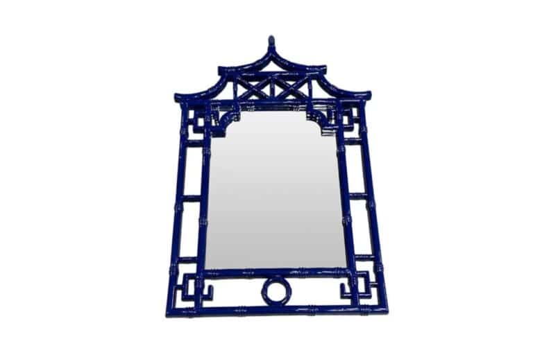 Ornate blue mirror with a decorative frame featuring a pagoda-inspired design.