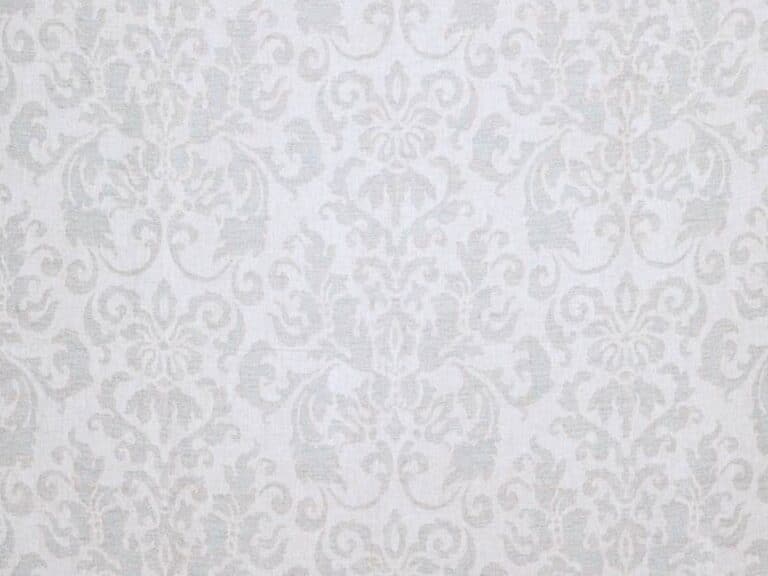 Light gray damask wallpaper featuring intricate floral patterns is reimagined in the Cowtan & Tout Linen Rokeby Damask Fabric, Colorway Patina.