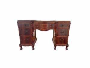 A French Carved Mahogany Vanity Ladies Desk, featuring multiple drawers and intricate ornate carvings.