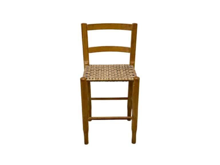 Wooden chair with a woven seat, featuring a simple backrest and sturdy legs on a white background.
