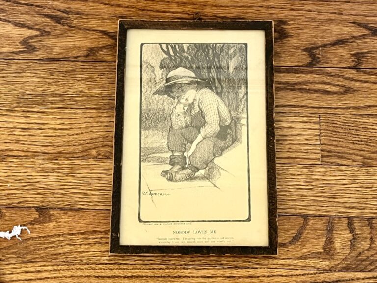 Antique framed print of a sad child entitled "Nobody Loves Me" by VC Andrews, featuring a child wearing a hat and boots on steps, copyright 1906 by Charles Scribner & Sons.
