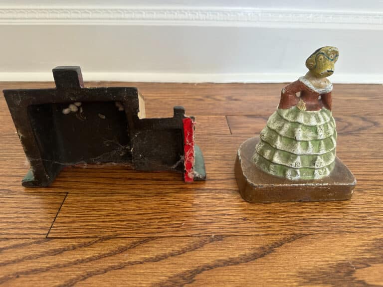 A vintage cast iron figurine of a woman in a green dress, titled "Cast Iron Painted Southern Lady," shown from two angles.