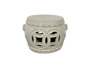 White ceramic garden stool with circular and square cutouts, adorned with dotted edge patterns.