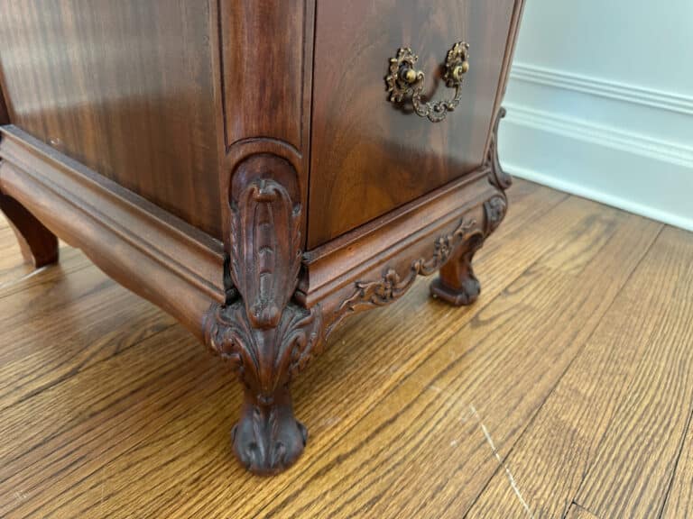 Intricately designed French Carved Mahogany Vanity Ladies Desk featuring ornate wooden legs with elaborate claw feet on a hardwood floor.