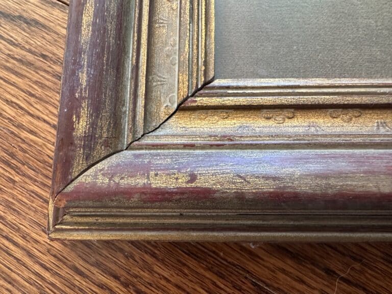 Detail of Passé Temps Des Dames Framed Prints, Set of 2, featuring ornate gold and red wooden corner detailing on a wood surface.