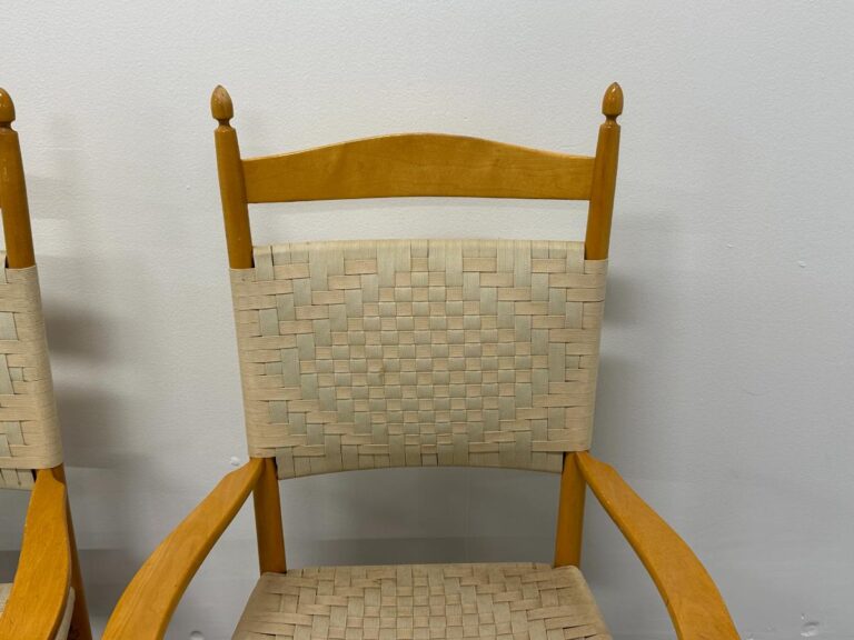 Wooden chair with woven backrest and seat, featuring an intricate diamond pattern design.