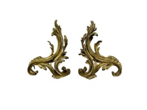 Ornate gold decorative scrollwork pieces with intricate, swirling leaf designs on a white background.