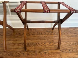 French Carved Mahogany Vanity Ladies Desk with decorative fabric straps on a wooden floor.