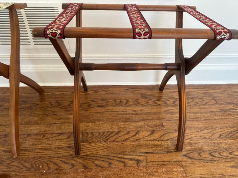 French Carved Mahogany Vanity Ladies Desk with decorative fabric straps on a wooden floor.