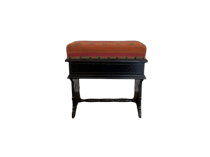 The Wood Carved Storage Bench features a red cushioned seat and intricately decorative legs, offering both style and storage.