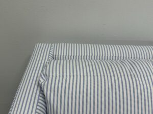 Serena & Lily Barton Sofa with blue and white striped upholstery nestled against a light gray wall.