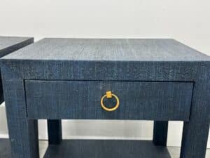 The Serena & Lily Driftway nightstand pair features a blue textured finish, each with a single drawer and stylish gold circular handle.