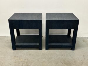 Two Serena & Lily Driftway One-Drawer Nightstands, dark blue and square with open shelves, placed side by side on a concrete floor.