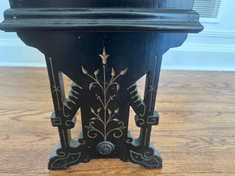 Wood Carved Storage Bench featuring ornate floral carvings set against a hardwood floor.