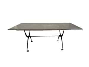 Rectangular table with a sleek metal top and curved metal legs.