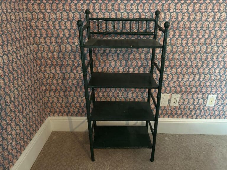 The Green Painted Bamboo Etagere, styled against patterned wallpaper with a floral motif.