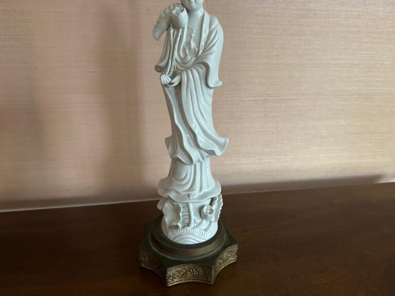 Porcelain Blanc De Chine Figural Lamp set featuring robed figures on decorative bases, set against a soft pink background.