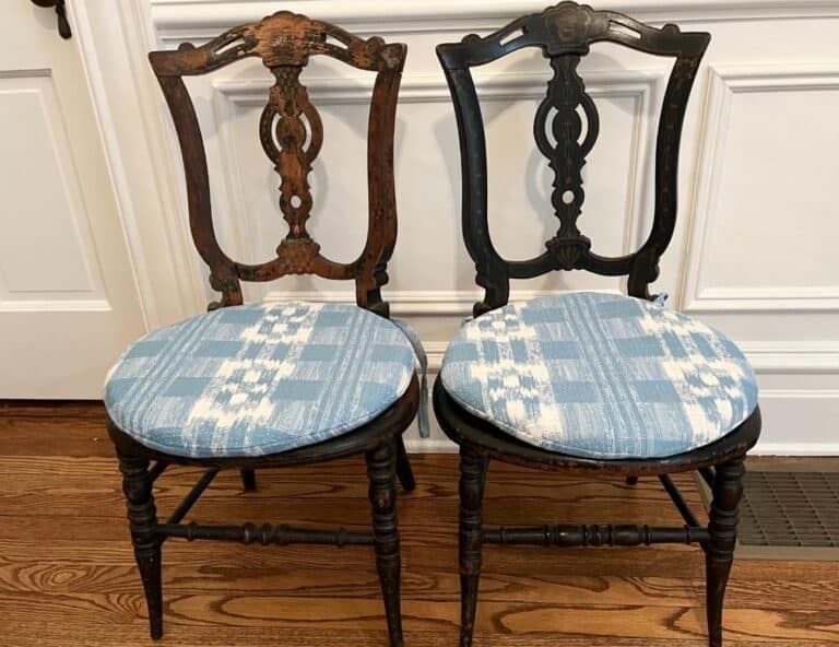 A pair of Petite Parlor Chairs with Sister Parish Mahalo Cushions set against a white wall and wooden floor.